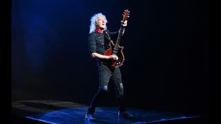 Queen guitarist Brian May performing.