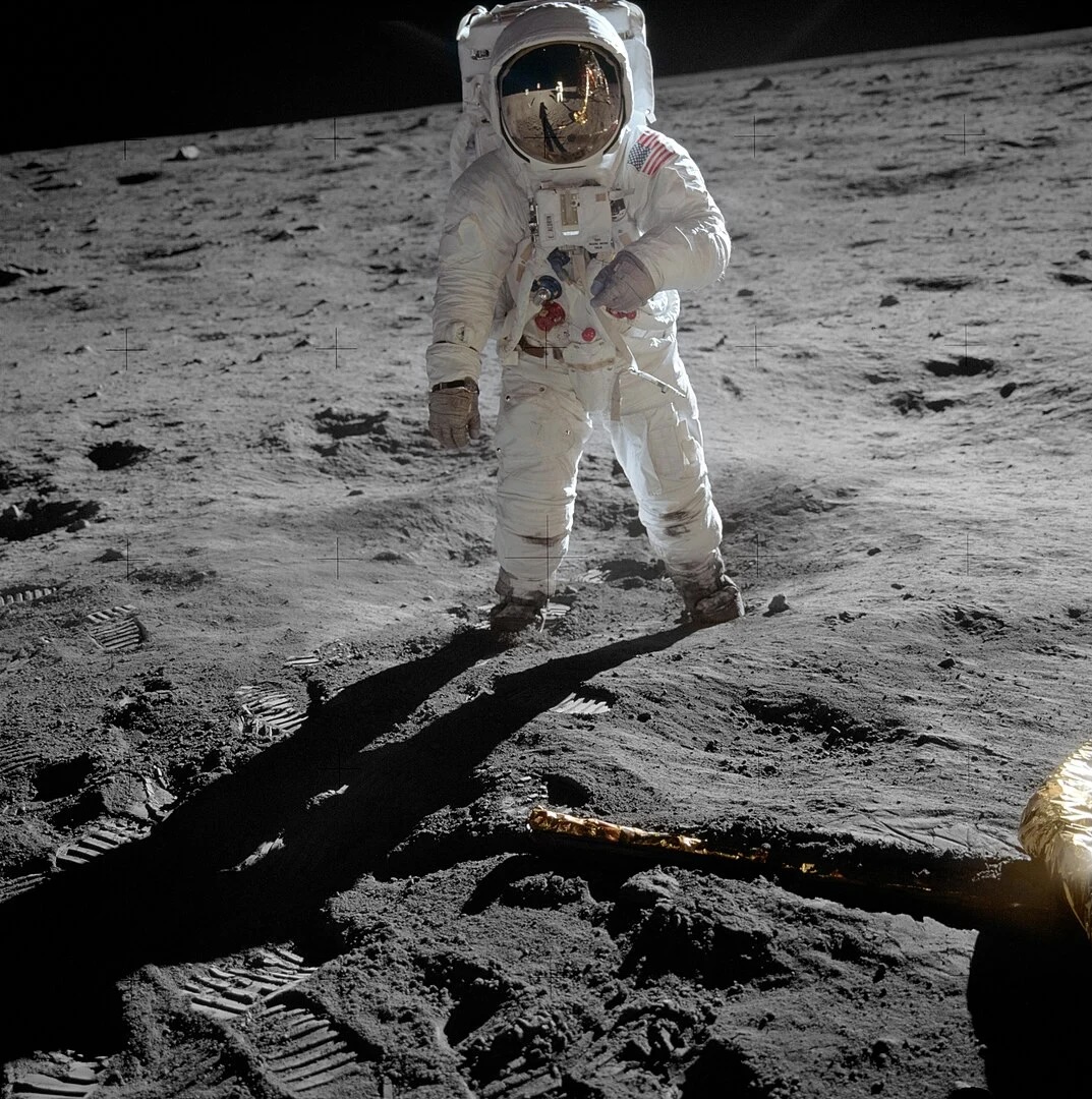 A photo of an astronaut standing on the surface of the moon