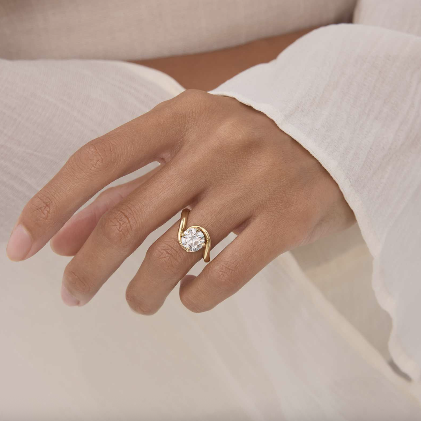 a model wearing a lab grown diamond engagement ring from kimai