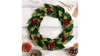 Felt wreath with green leaves and red berries