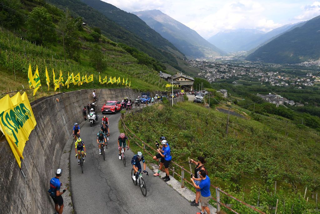 APRICA ITALY MAY 24 Lennard Kmna of Germany and Team Bora Hansgrohe Jan Hirt of Czech Republic and Team Intermarch Wanty Gobert Matriaux Hugh Carthy of United Kingdom and Team EF Education Easypost Koen Bouwman of Netherlands and Team Jumbo Visma Team Blue Mountain Jersey Wouter Poels of Netherlands and Team Bahrain Victorious Thymen Arensman of Netherlands and Team DSM and Alejandro Valverde Belmonte of Spain and Movistar Team passing through Teglio 851m during the 105th Giro dItalia 2022 Stage 16 a 202km stage from Sal to Aprica 1173m Giro WorldTour on May 24 2022 in Aprica Italy Photo by Tim de WaeleGetty Images