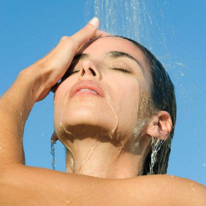 girl washing face - face wipe ban