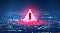 Cybersecurity alert concept image showing a red glowing warning symbol placed on top of a digital interface.