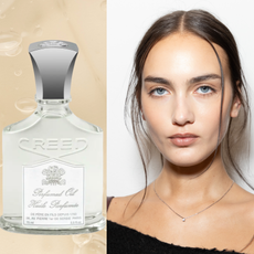A woman next to a bottle of creed perfume oil. 