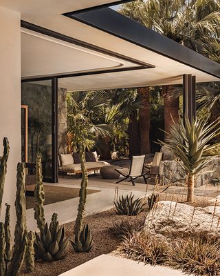 rancho mirage house showcasing low lying, modernist architecture with lots of desert planting and outdoor areas