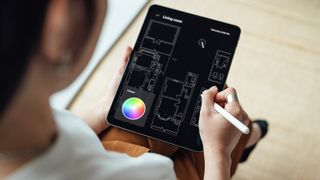 woman using home design app on tablet