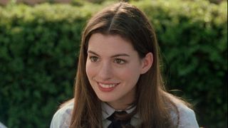 Anne Hathaway smiling in The Princess Diaries. 