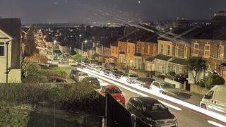 A long exposure photo of car headlights
