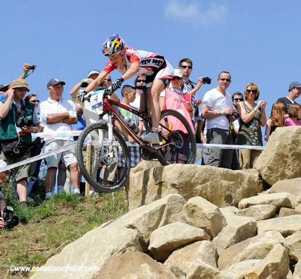 Elisabeth Osl launches off the rocks