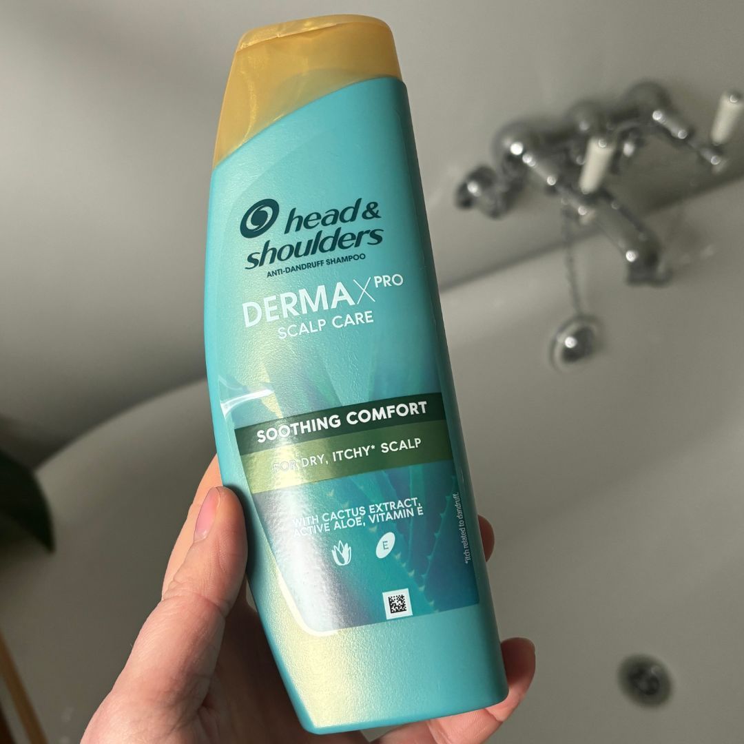 Laura holding Head&amp;Shoulders DERMAXPRO Soothing Anti-Dandruff Shampoo