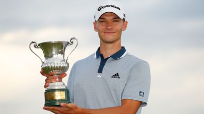 Nicolai Hojgaard poses with the trophy after winning the 2021 Italian Open