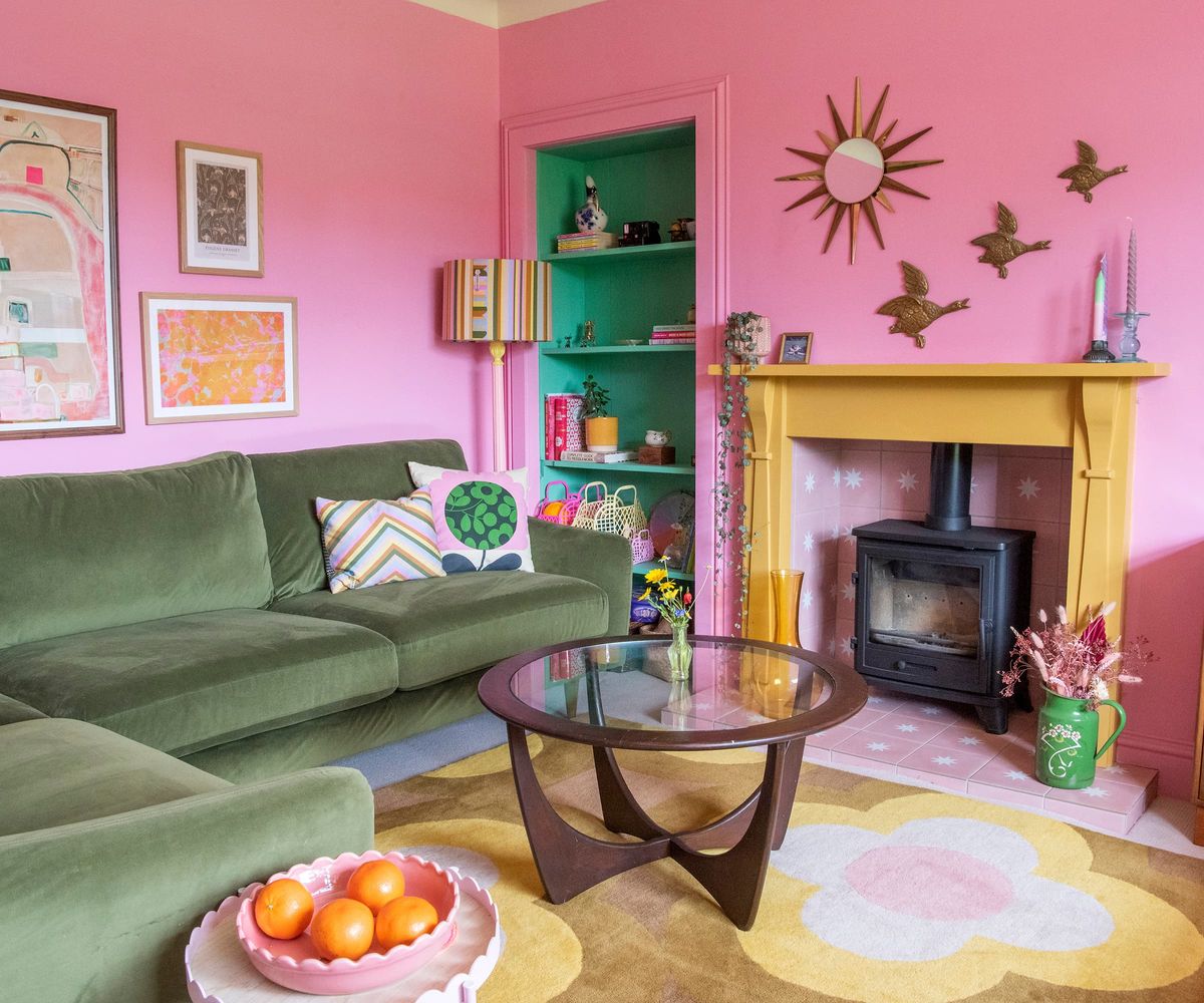 A pink living room and a green sofa