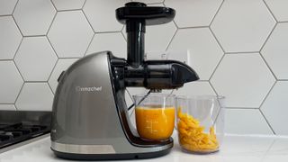 The Amzchef Slow Juicer ZM1501 having just been used to juice oranges