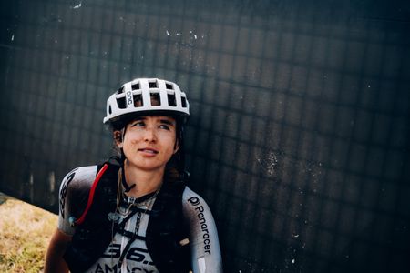 Maddy Nutt sits down at the finish of the Traka 560