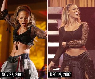 J.Lo (2001) & Beyonce (2002) in black crop top with sheer sleeves, black bottoms, and pulled-back hair.