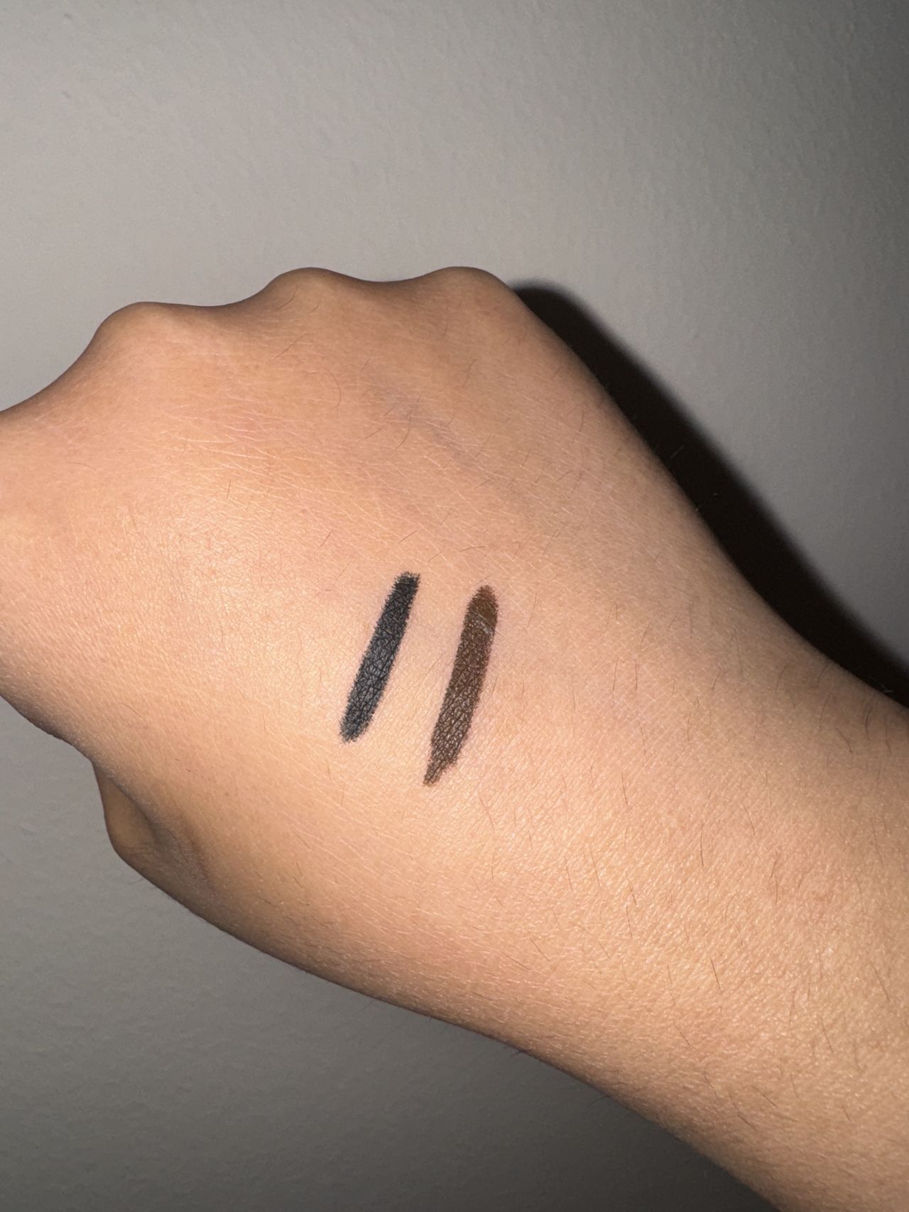 Makeup By Mario Master Pigment Pro&trade; Eyeliner Pencil black and brown swatches on back of hand
