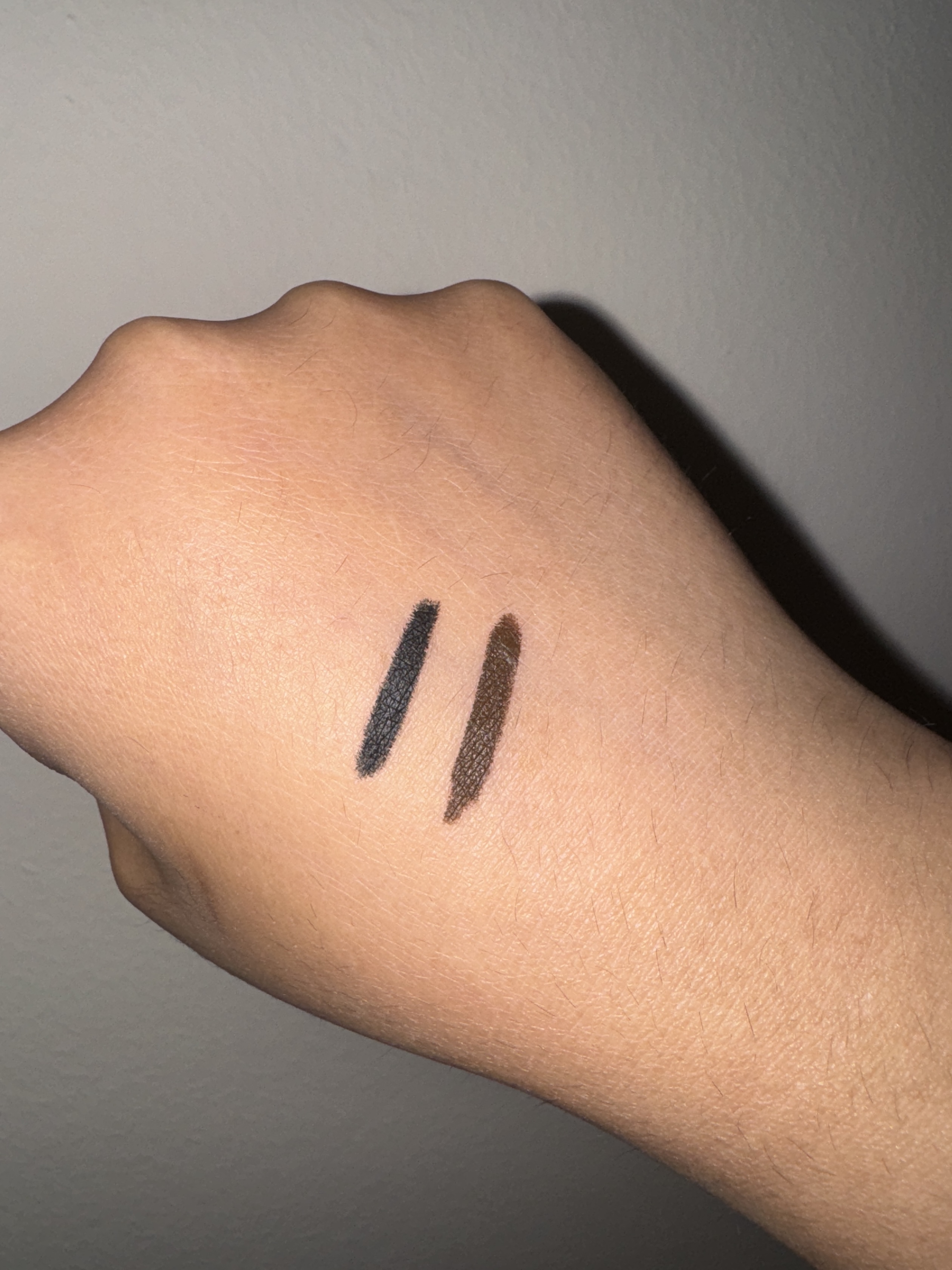 Makeup By Mario Master Pigment Pro™ Eyeliner Pencil black and brown swatches on back of hand