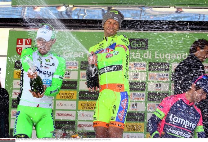 Mauro Finetto (Yellow Fluo) sprays the winners champagne