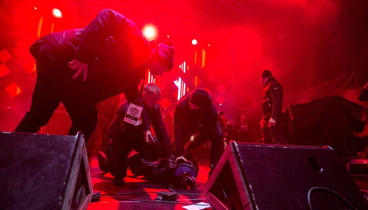 Security subdues a man who stabbed the mayor of Gdansk on stage in front of hundreds of people