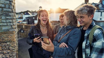 Family with teens laughing at jokes