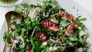 a tangle of steak and greens
