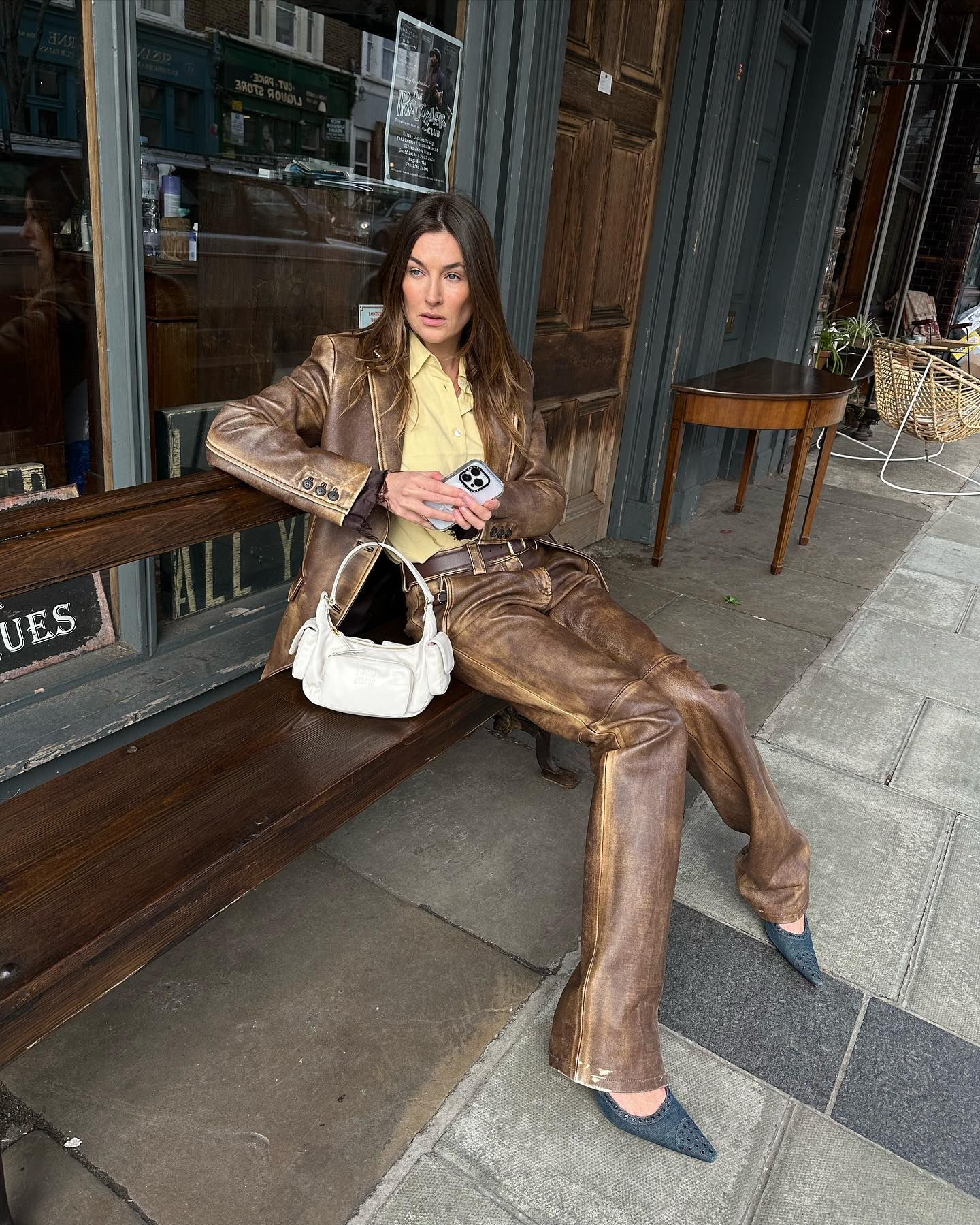 An image of @camillecharriere wearing the Miu Miu pocket bag, one of the best Miu Miu bags.