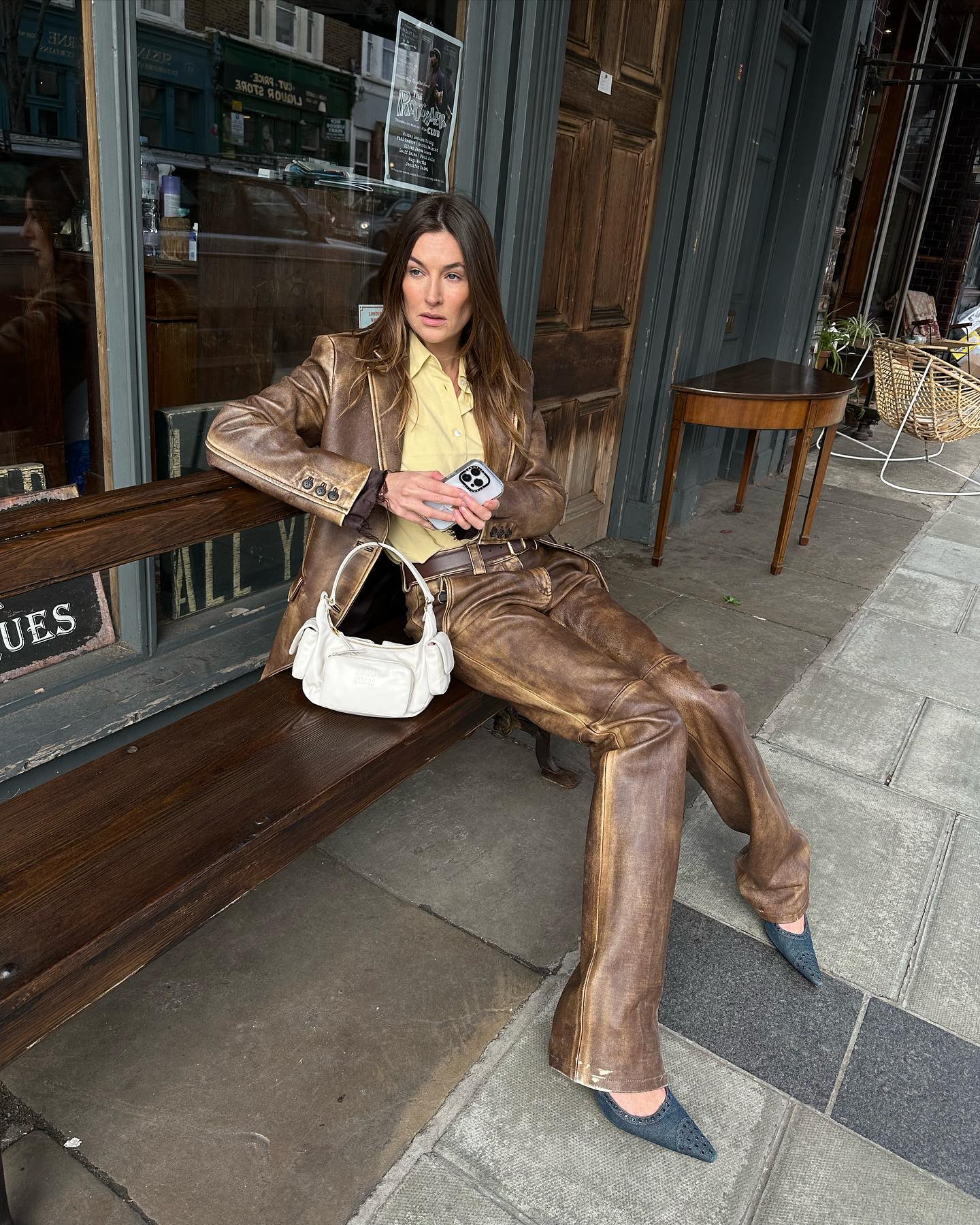 An image of @camillecharriere wearing the Miu Miu pocket bag, one of the best Miu Miu bags.