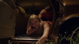 Maika Monroe in car in It Follows