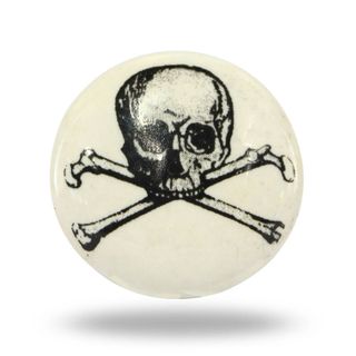 A white ceramic door knob with a skull and crossbones print