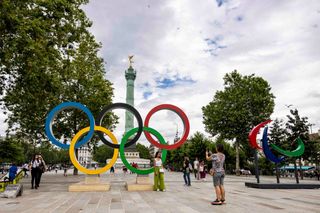 Visitors take photos next to Olympic and Paraolympic rings near Plaza de la Bastilla ahead of Paris 2024 Olympic Games on July 15, 2024 in Paris, France. (Photo by Maja Hitij/Getty Images)