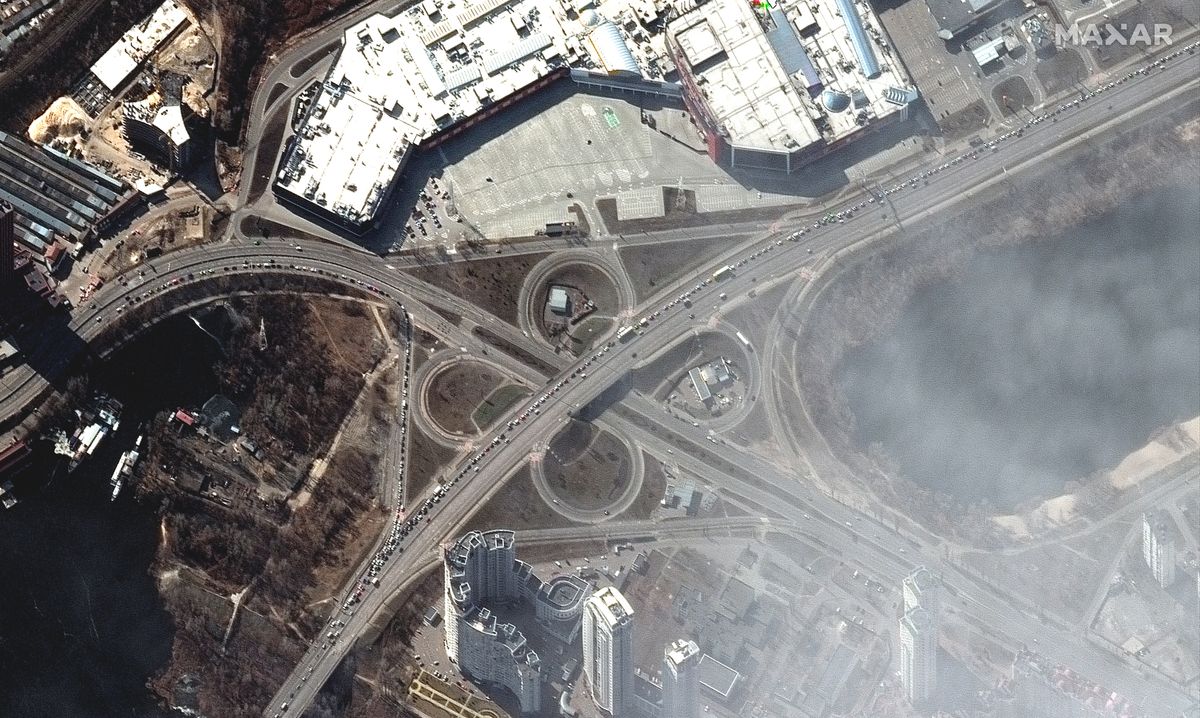 People and long line of cars trying to leave Kyiv, Ukraine on March 11, 2022 as seen by the WorldView-2 satellite for Maxar Technologies.