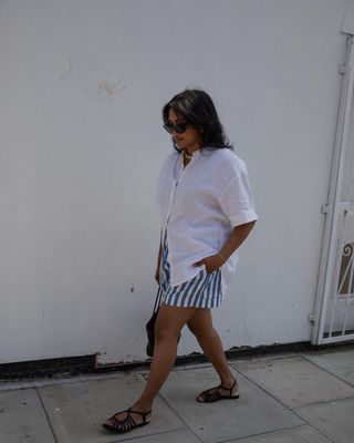 @chiarasatelier wearing striped shorts and sandals