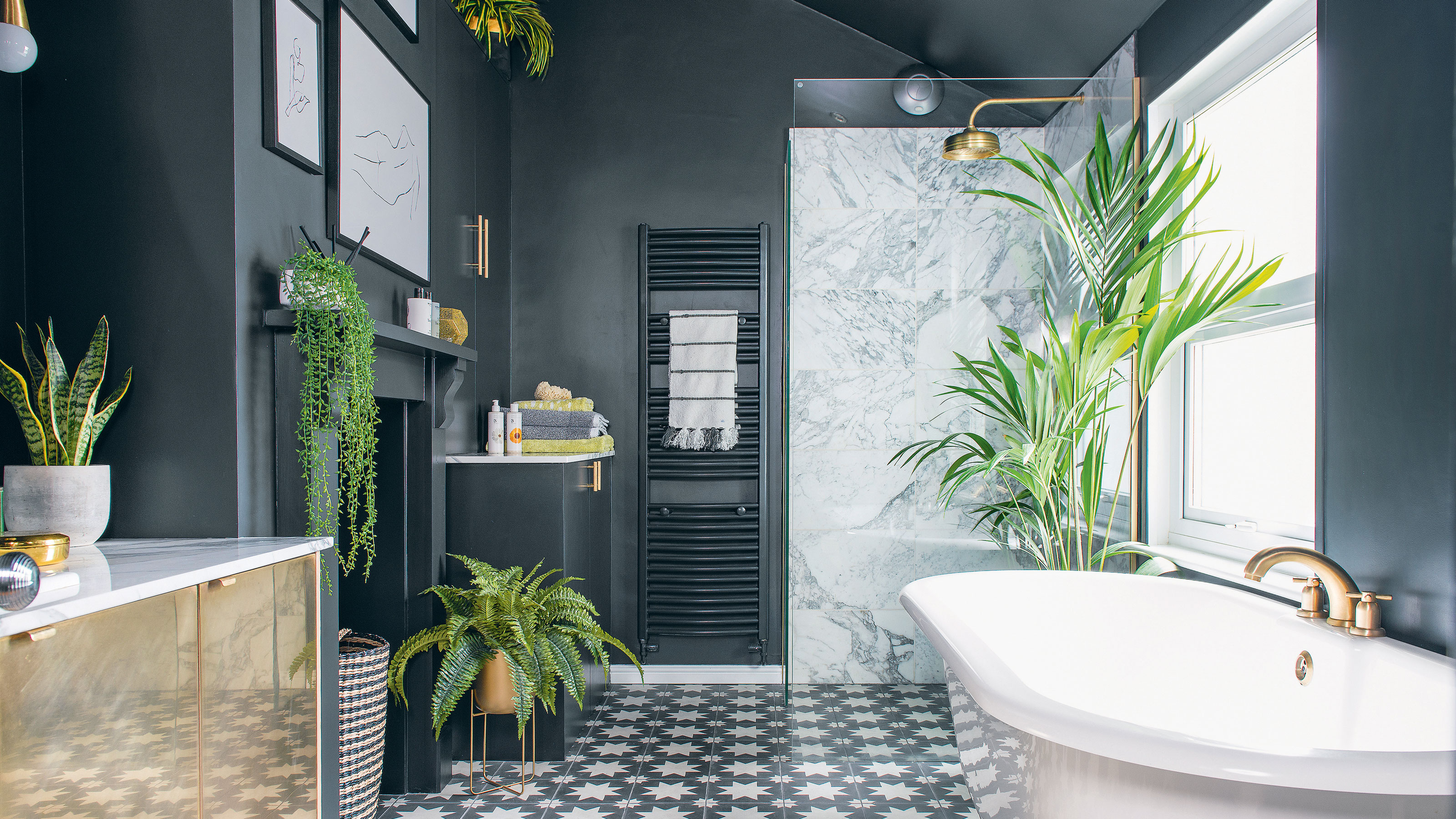 Navy bathroom with marble shower and white bathtub