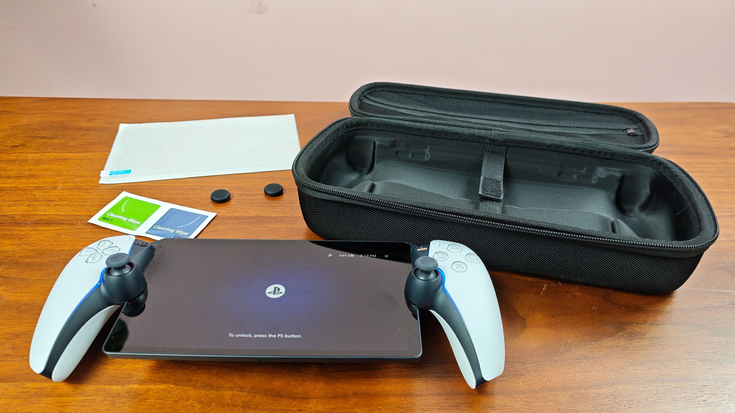 Venom PlayStation Portal Carry Case with accessories and PS Portal on table