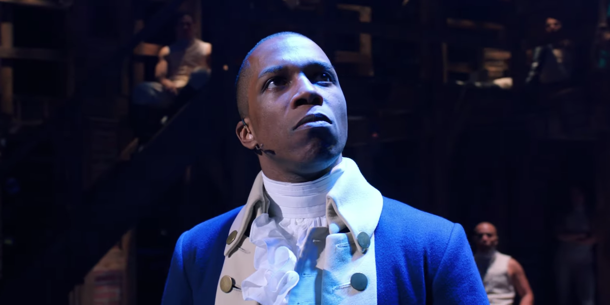 Aaron Burr (Leslie Odom Jr.) stands on stage and looks up during a performance of &#039;Hamilton&#039;