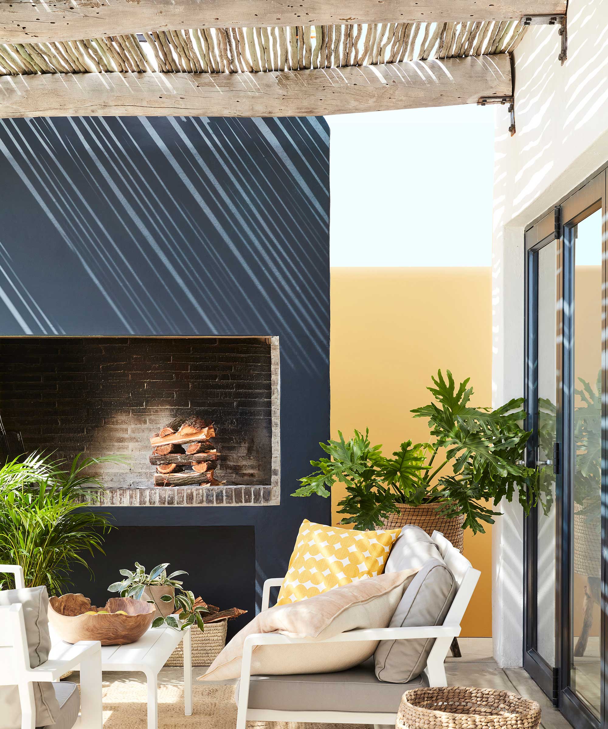 overhead shelter on patio with fireplace