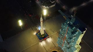 China rolls out the Long March 2F rocket and crew capsule for the Shenzhou 20 astronaut mission on April 16, 2025.