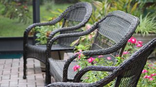 Black wicker chairs outside