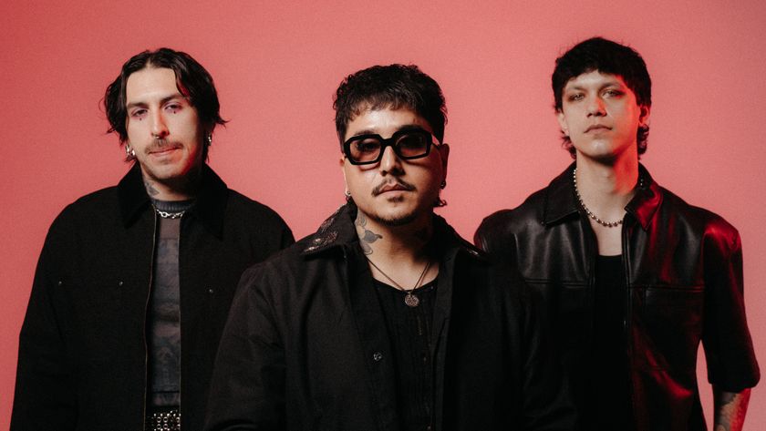 Dayseeker dressed in black against a pink background