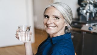 older woman drinking water no sugar diet