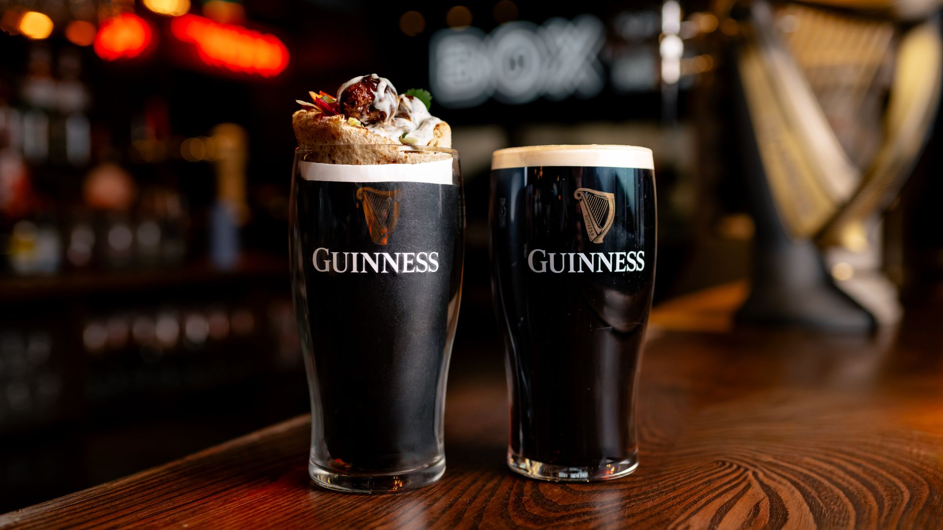 an image of the guinness kebab in a pint glass next to a pint of guinness