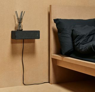 bedroom with speaker attached to wall as a shelf by ikea