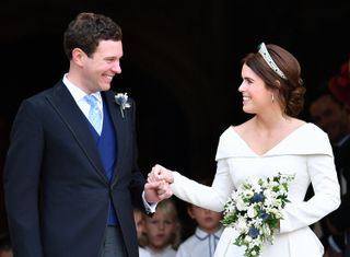 Jack Brooksbank and Princess Eugenie leave St George's Chapel after their wedding ceremony on October 12, 2018 in Windsor, England