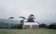 Redhill Barn as seen in a misty morning in the countryside