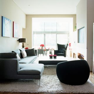 living room with sofa and ball chair