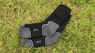 EDZ waterproof socks lying in the grass