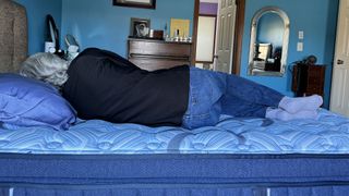 Reviewer lying on the Stearns & Foster Estate mattress