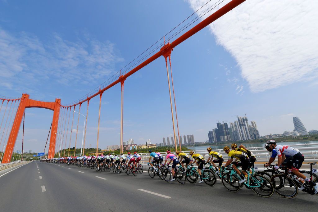 The peloton cross a bridge in Nanning