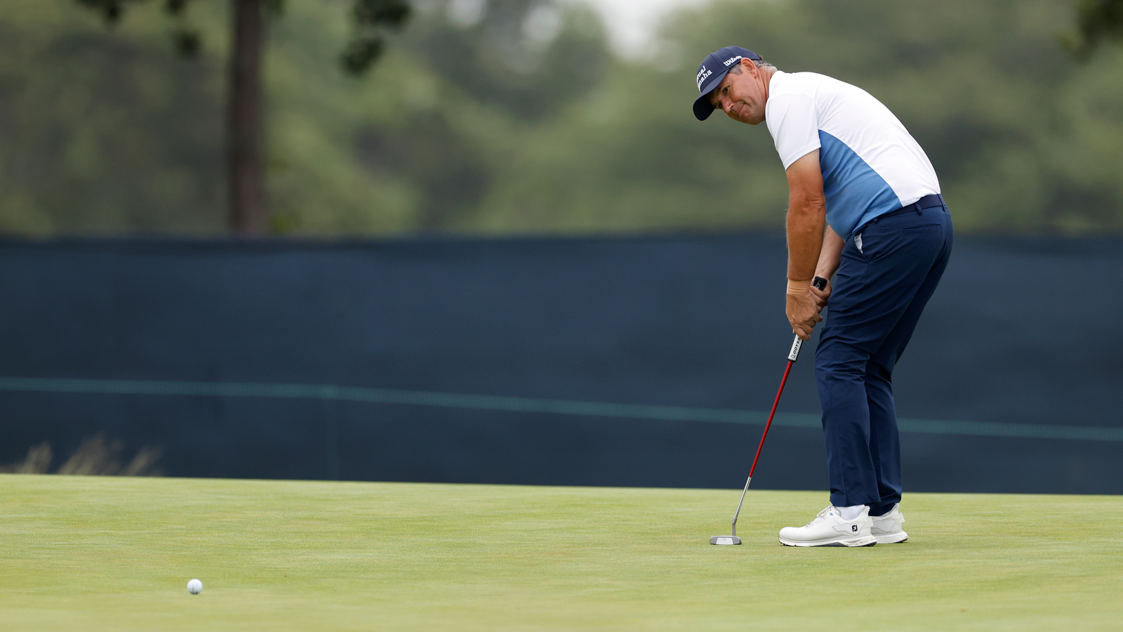 Padraig Harrington hits a putt