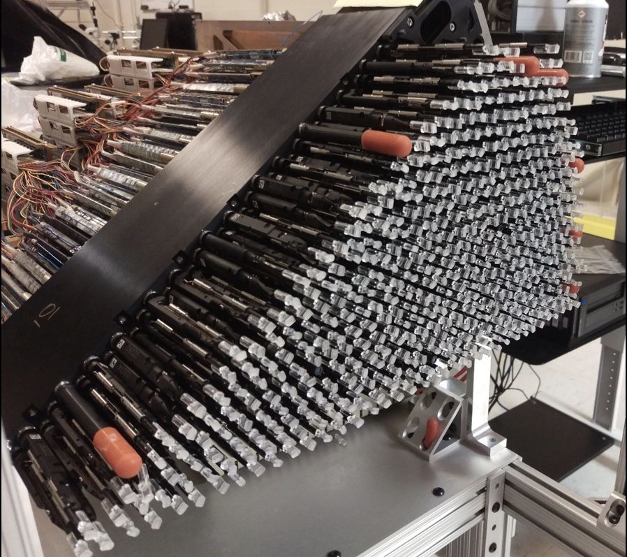 The 5,000 pencil-size robots will fit snugly inside 10 wedge-shaped petals. Here, one of those wedges is fully stocked with 500 robots, each of which will swivel independently to gather light from a known group of space objects, including distant galaxies